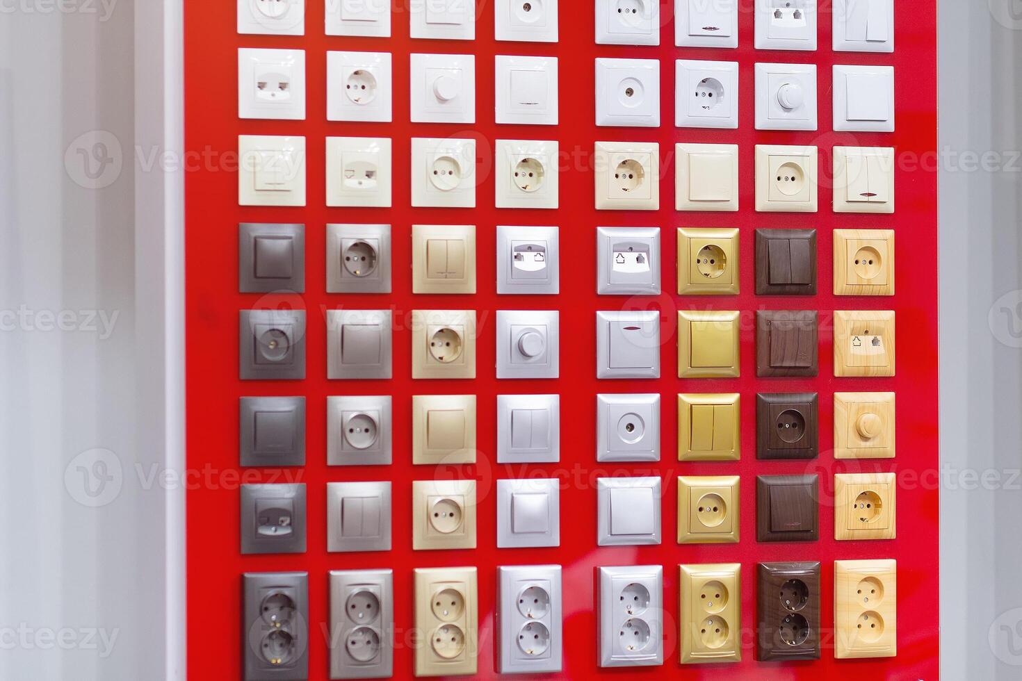 Electrical household sockets and switches on the stand in the store photo