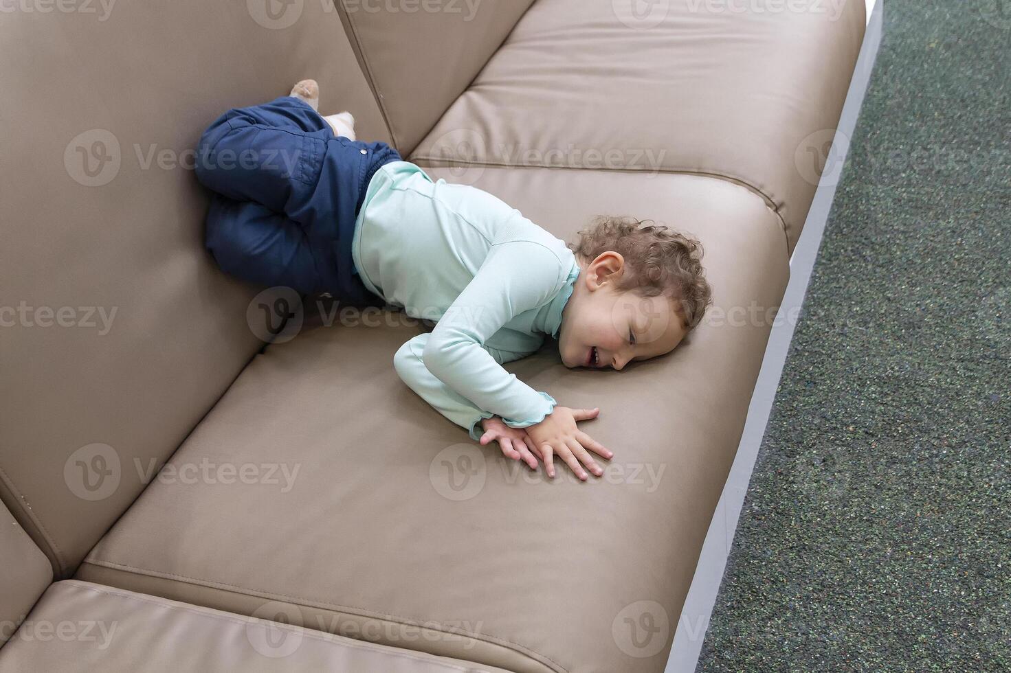 Cute child child of three years on the playground of the shopping mall photo