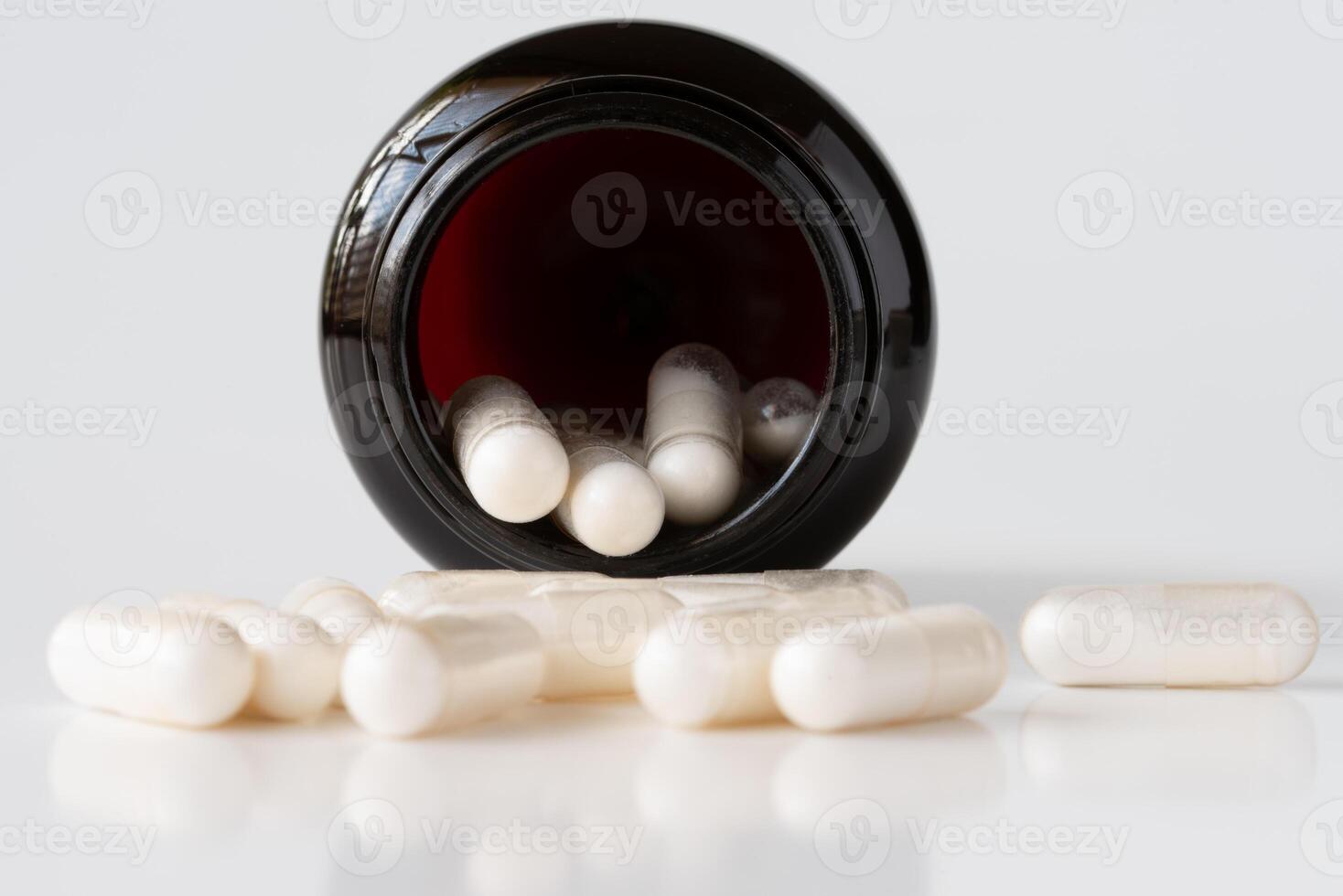 Probiotic Capsules Spilled from a Container photo