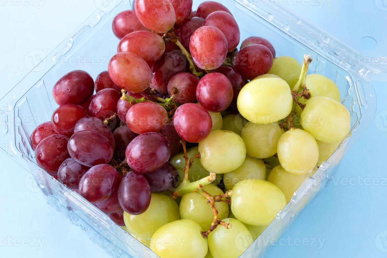 Red and Green Grapes in a Plastic Container photo