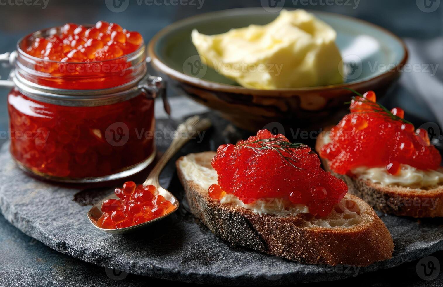 Red caviar on bread with butter and salt photo
