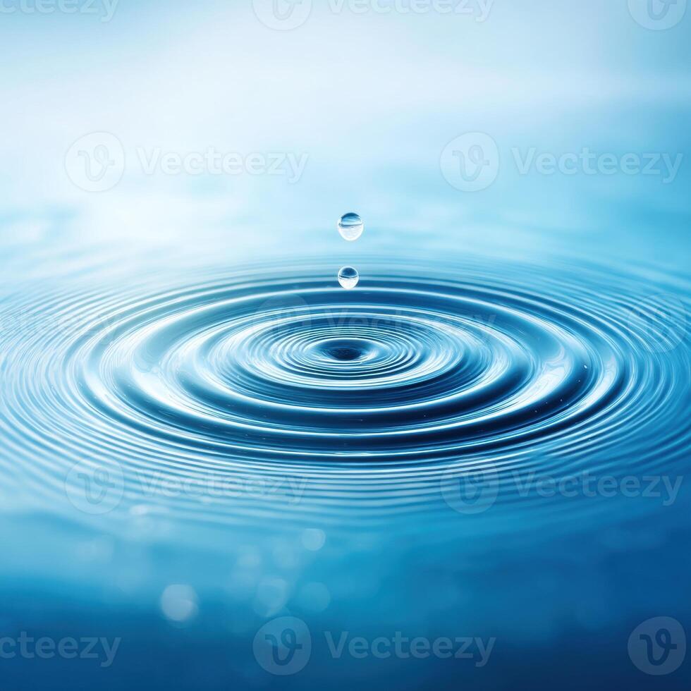 Water Drop Creates Ripple Effect on Liquid Surface photo