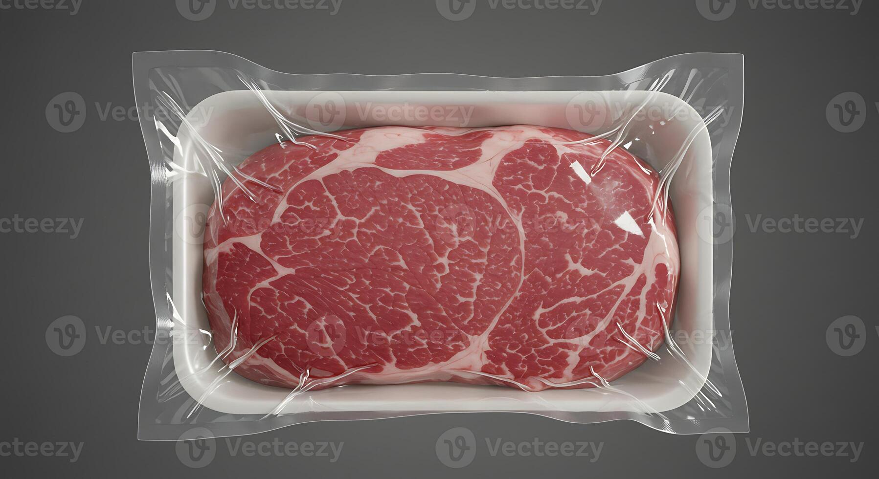 A piece of meat in a plastic container on a gray background photo