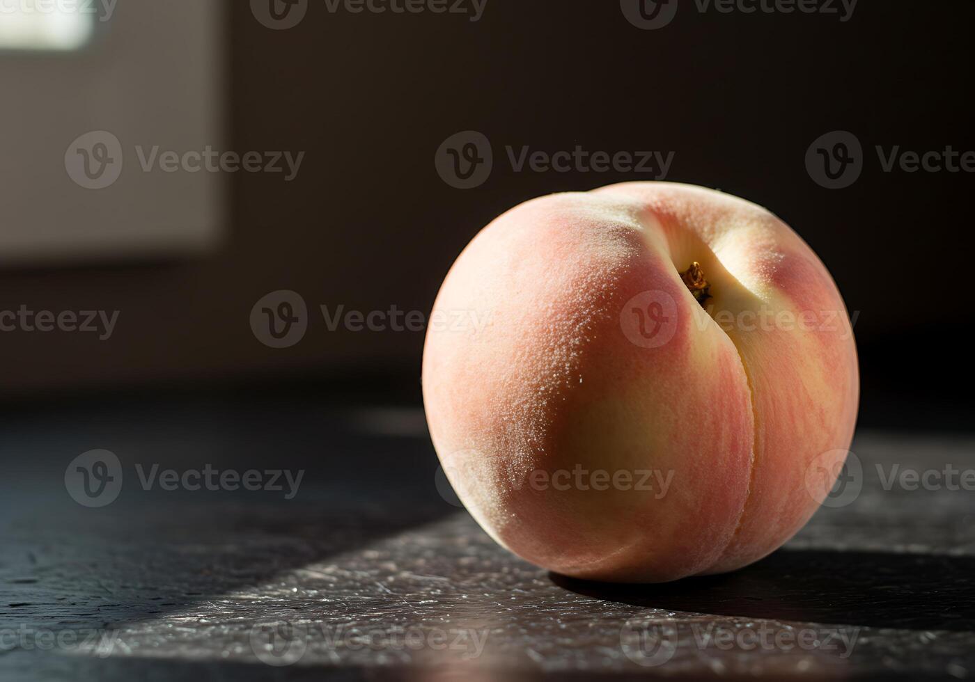 A peach sitting on a table photo