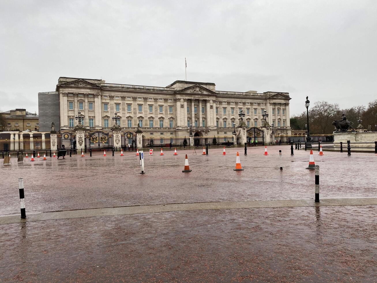 A view of Buckingham Palace in London in July 2023 on a wet day photo
