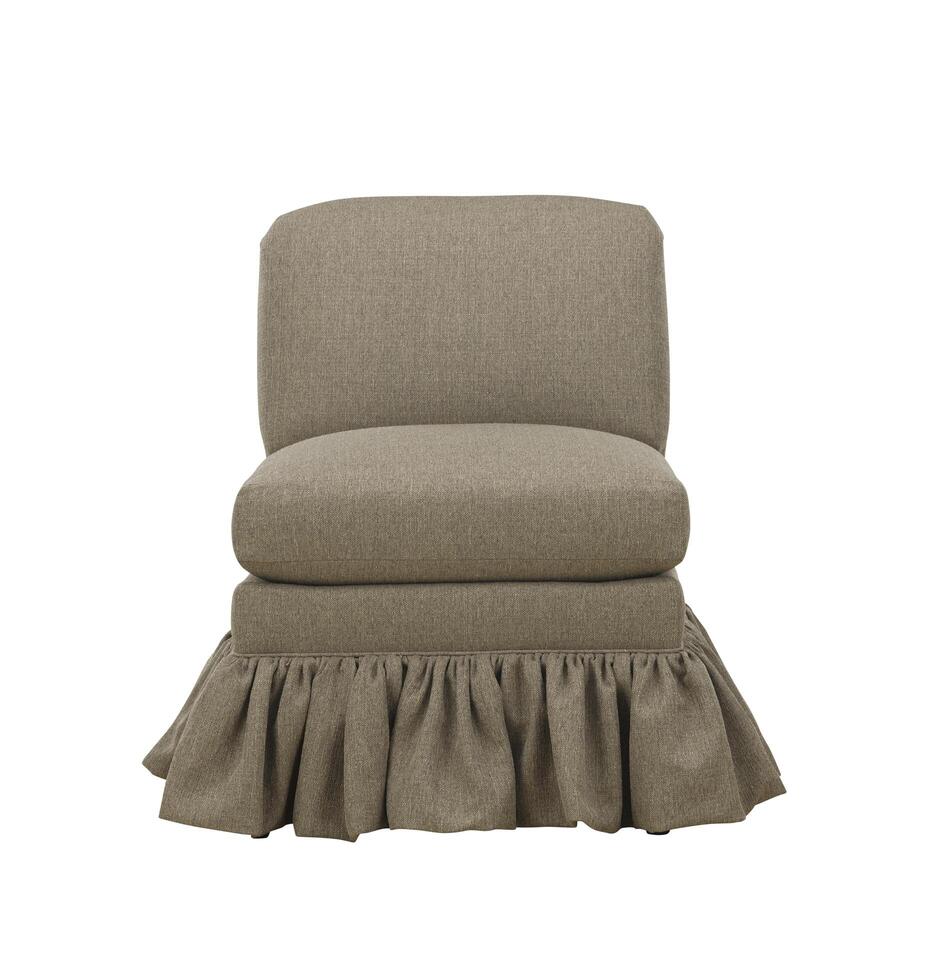 Neutral textured armless chair with ruffled skirt isolated on white photo