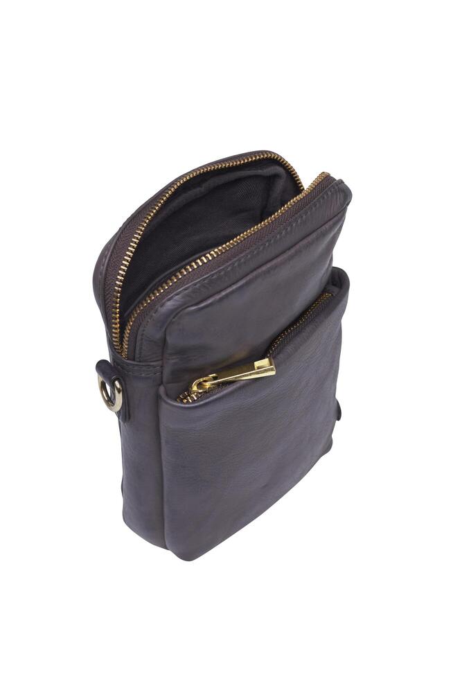 Open dark gray leather crossbody bag with gold zippers isolated on white photo