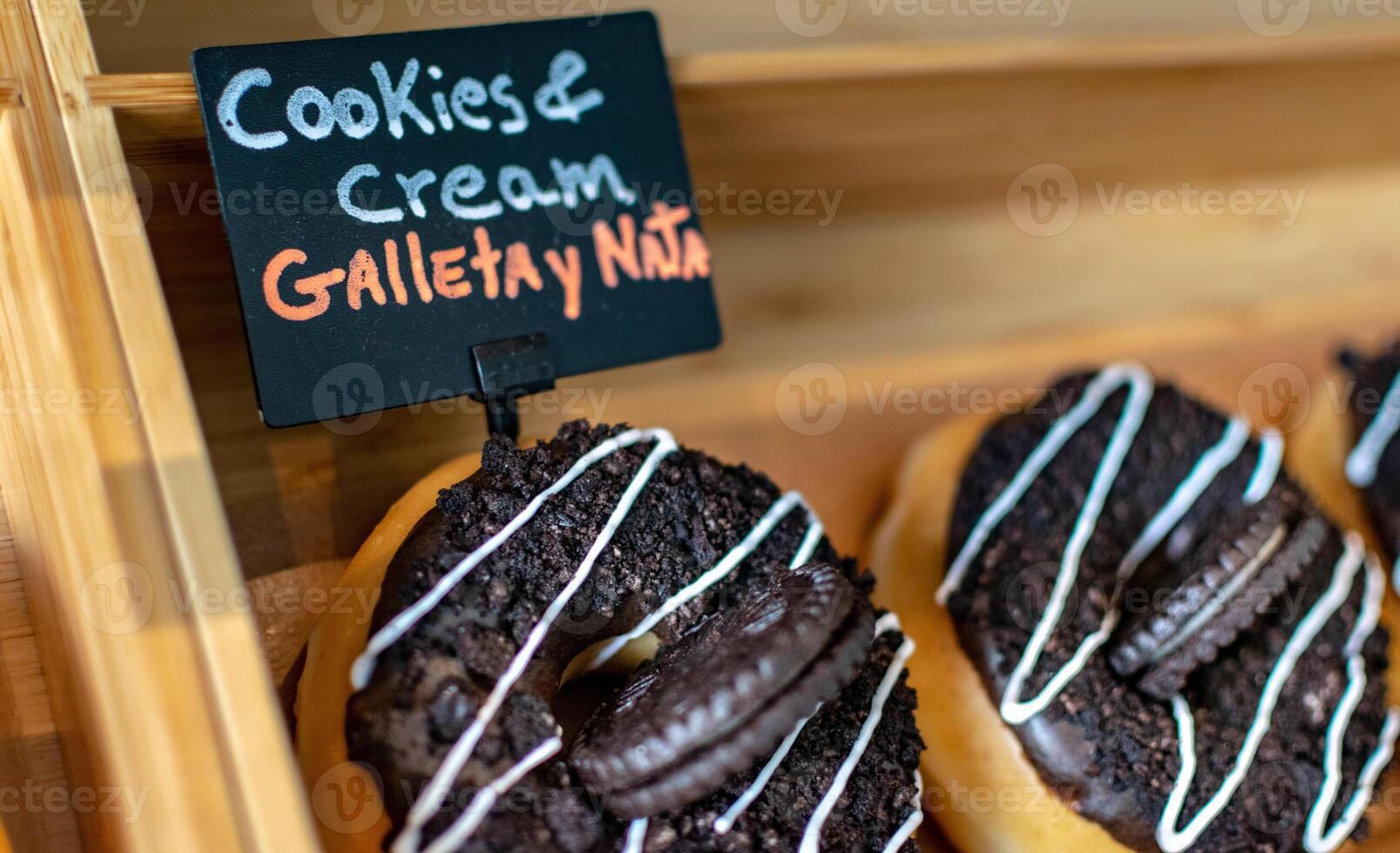 a close up macro image of cookie and cream donuts in a bakery photo