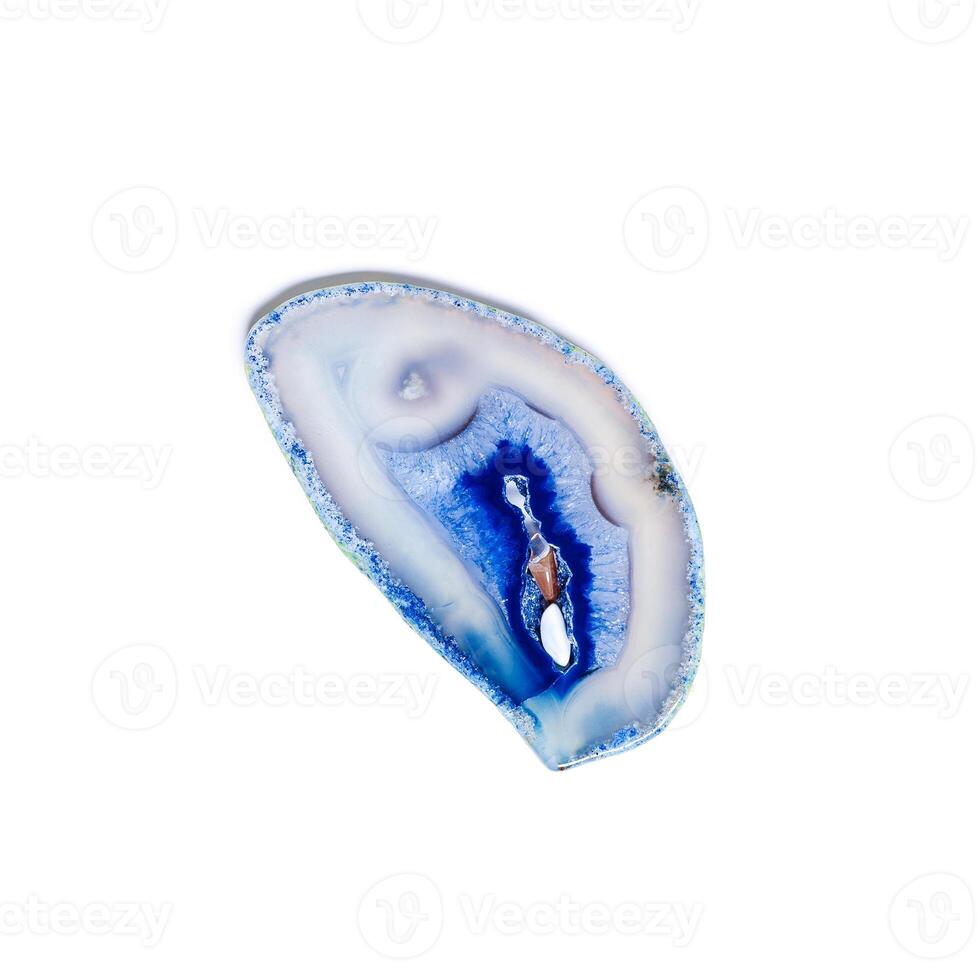 Cross section of blue agate crystal isolated on white background, natural slice mineral stone macro closeup, agate crystal surface, beautiful gemstone top view. Precious stone bright color photo