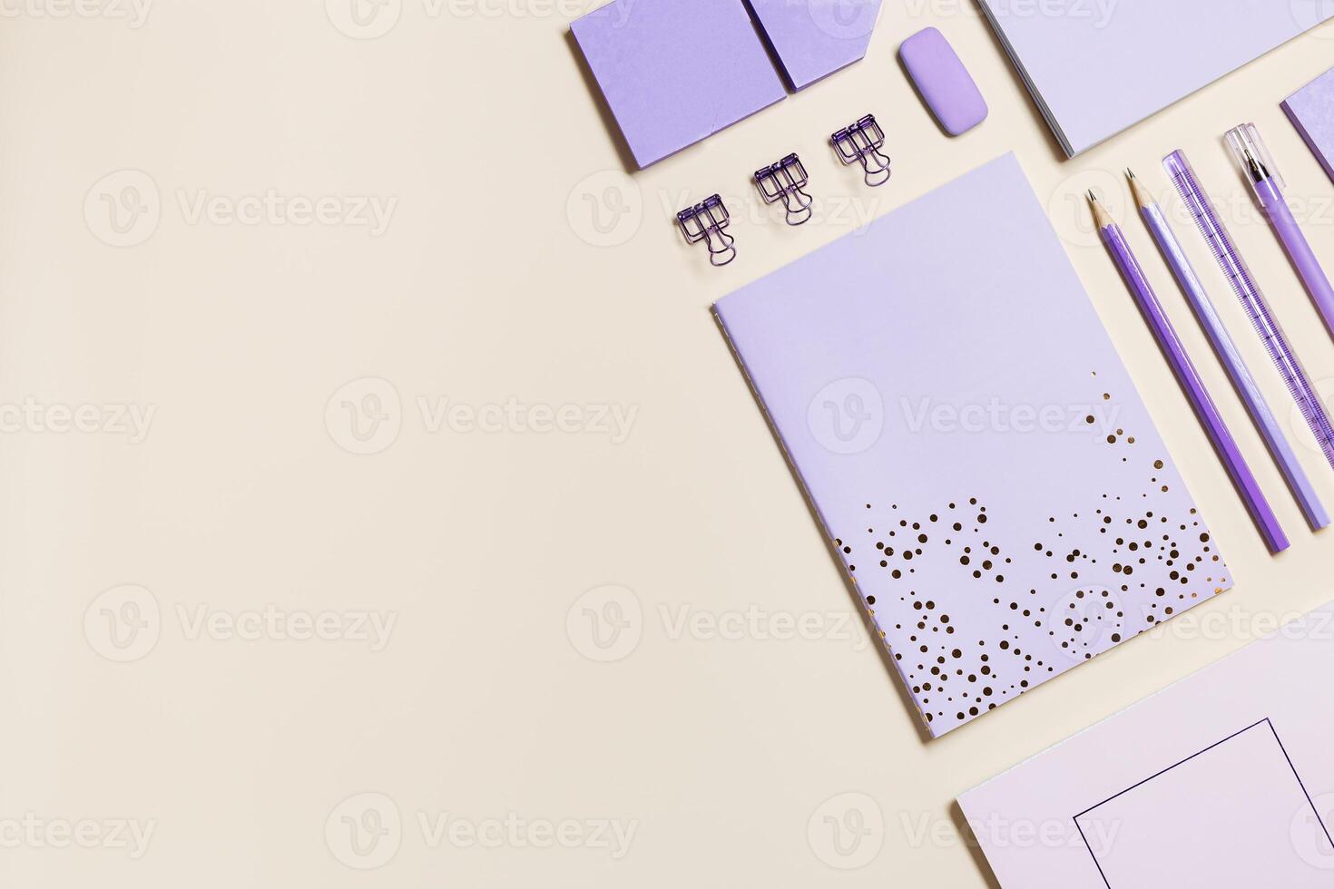 Frame with notebook very peri trend colored and pencil, pen, paper clips, school stationery. Back to school concept on beige background, copy space. Office supplies, geometric flat lay banner photo