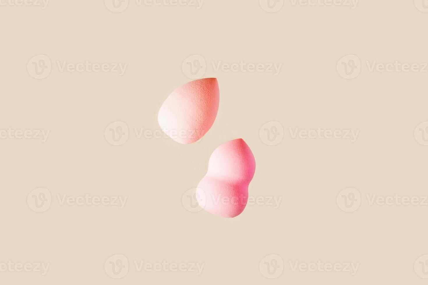 Beauty blender sponge pink beige colored. Soft make up cosmetic sponge, brush for face skin, facial applicator. Backgrounds for salon fashion beauty makeup. Neutral pastel color. photo