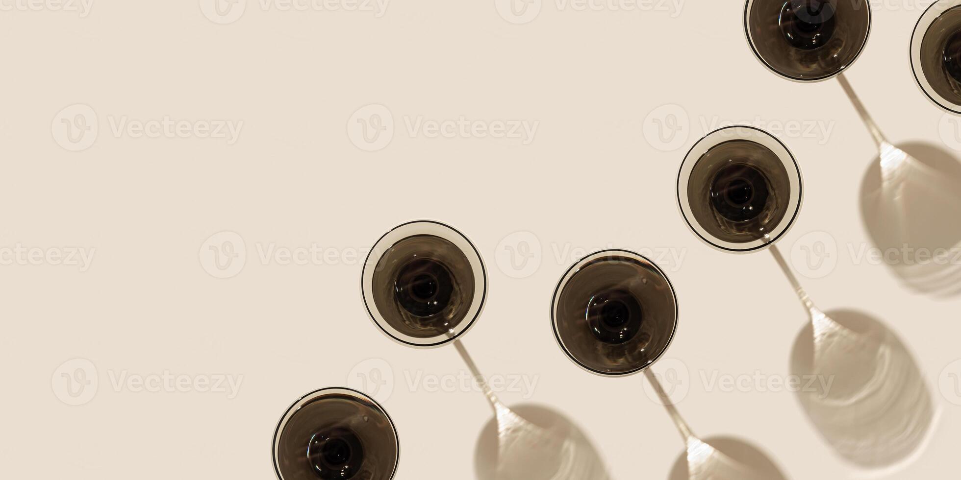 Creative pattern with champagne glass grey colored glass on beige background with hard shadows from sunlight. Summer drink concept. Trendy colored wine glass. Top view wide banner photo