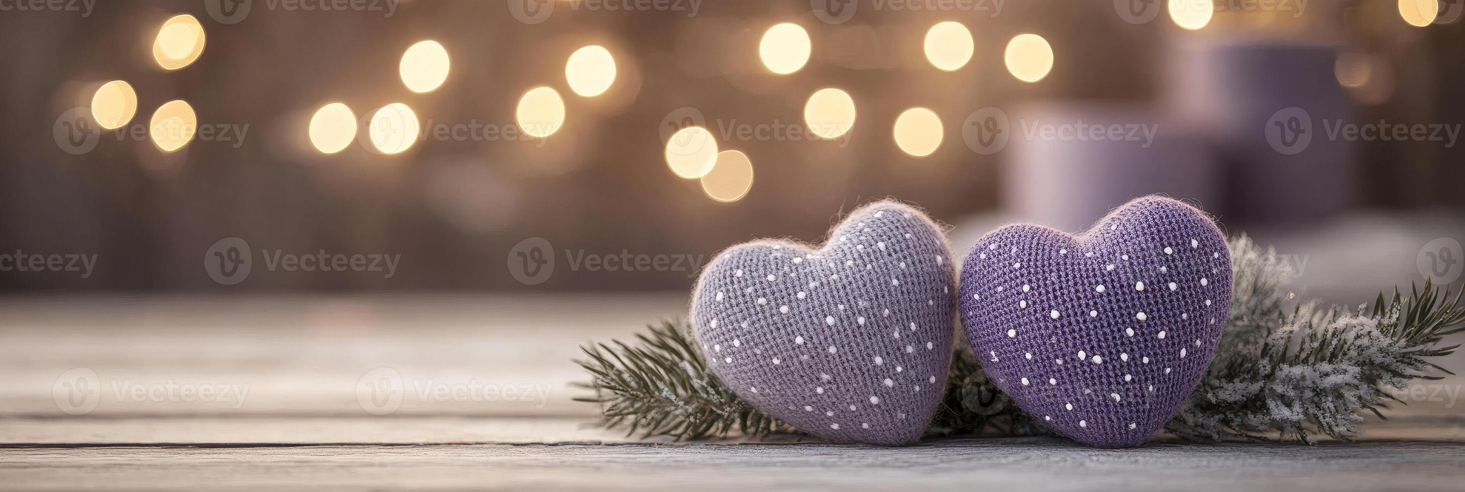 Two Purple Knit Hearts With Shiny Spots And Spruce Branches On Wooden Background With Bokeh Lights photo