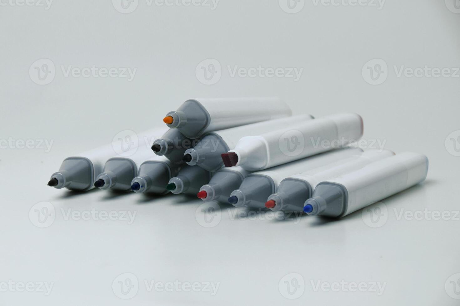 Open Colorful Markers on White Background photo