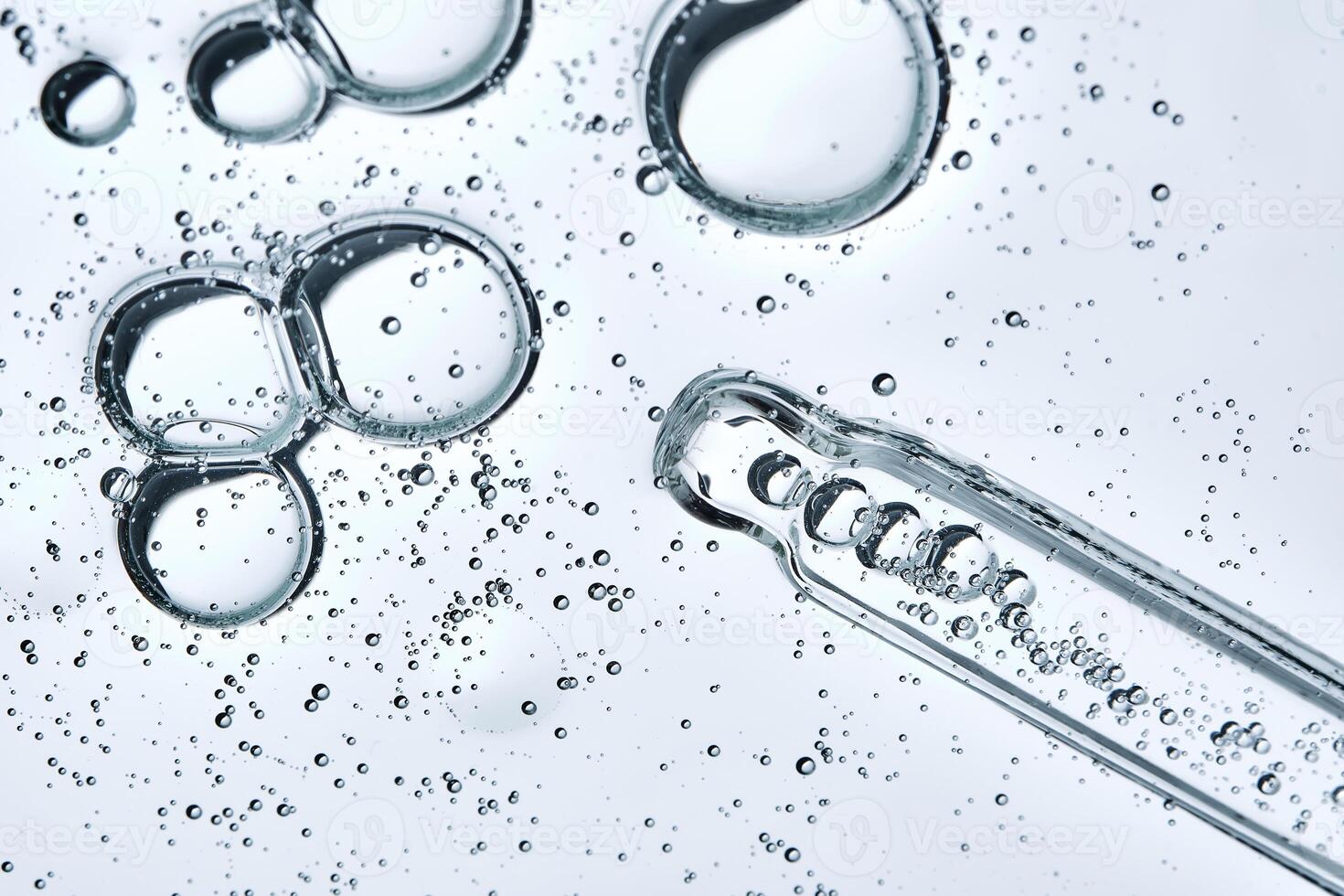 The texture of a serum or cosmetic gel with a pipette. Angle from below. photo