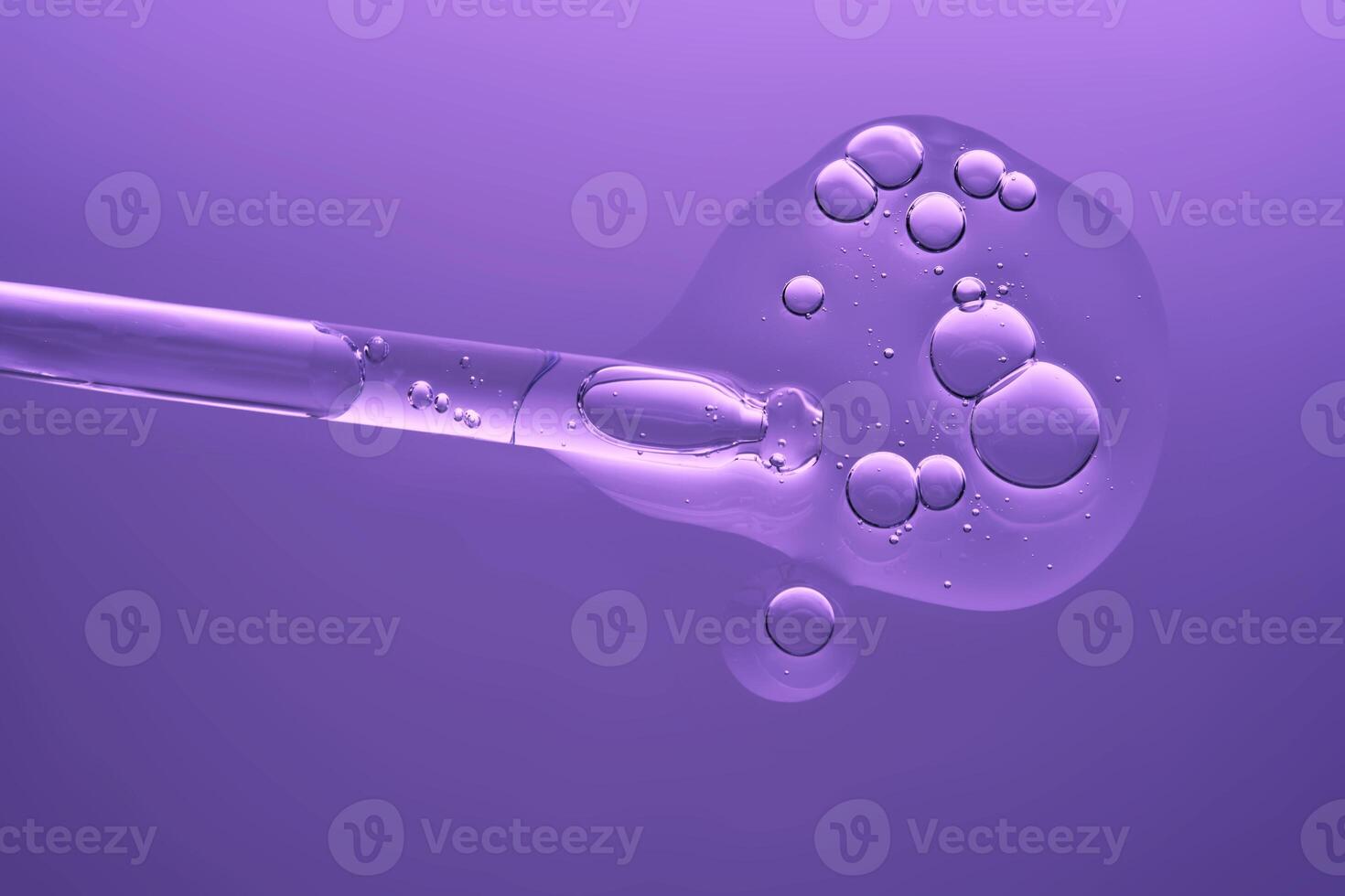 Serum with peptides on a lilac background with a pipette. The texture. photo