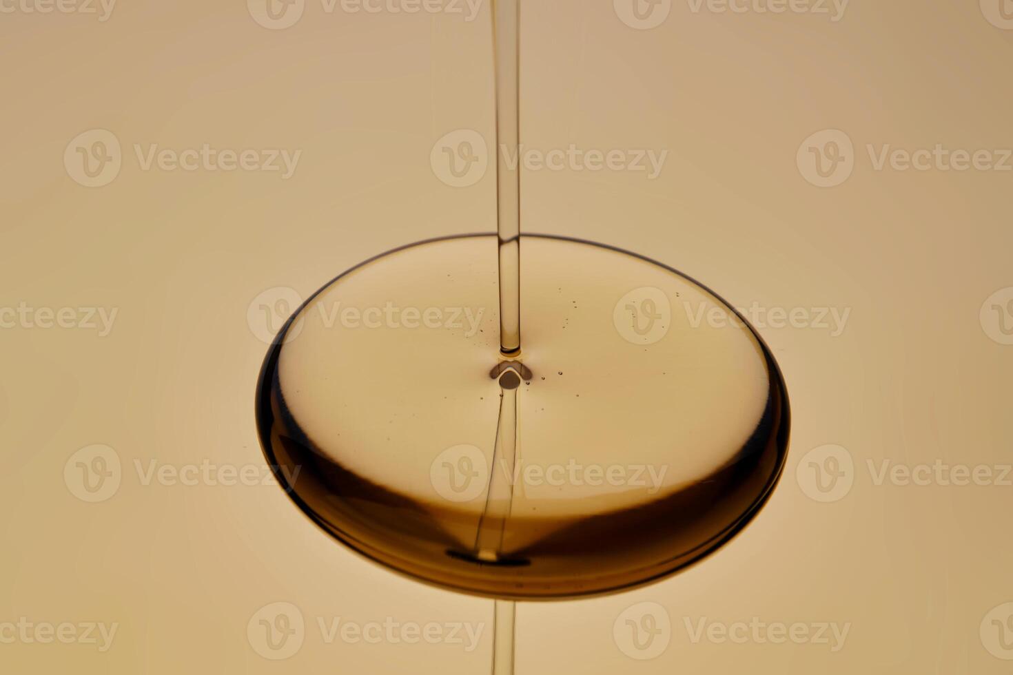 The texture of the flowing oil on a golden background. photo