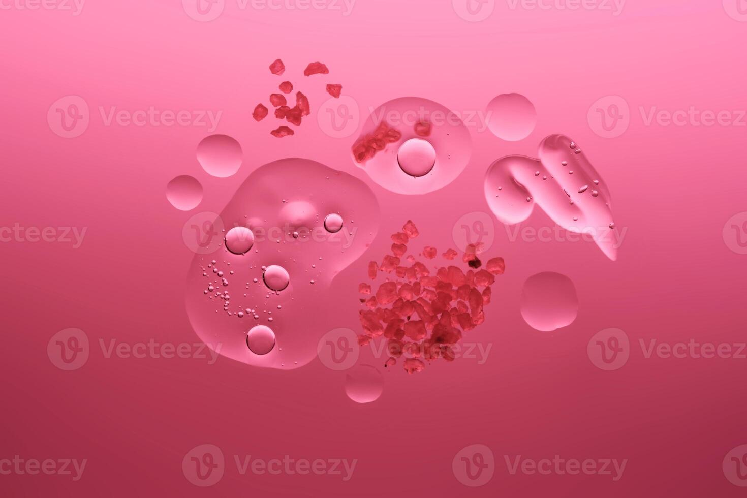 Different textures of cosmetics with a rose in the composition on a scarlet background. photo