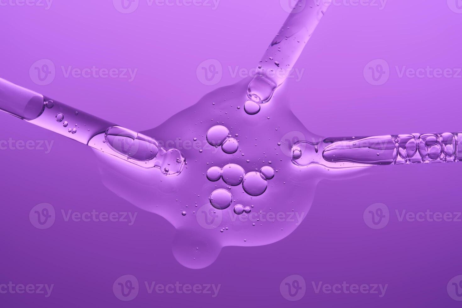 Demonstration of the texture of hyaluronic serum on a lilac background. photo
