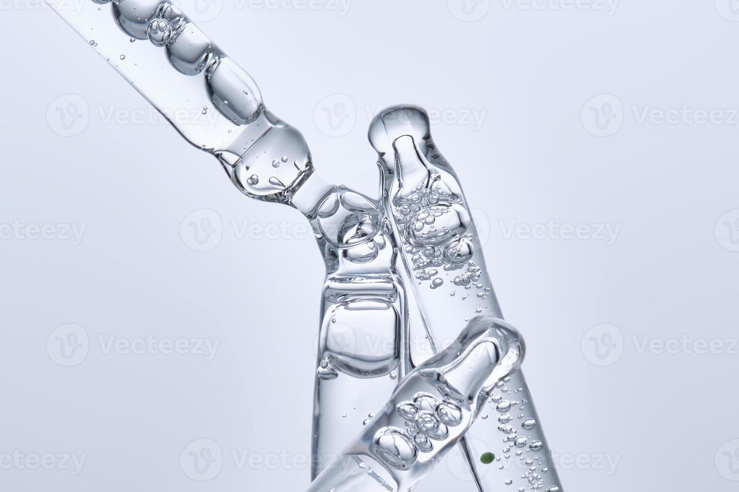 Four different face serum pipettes on a neutral background. photo