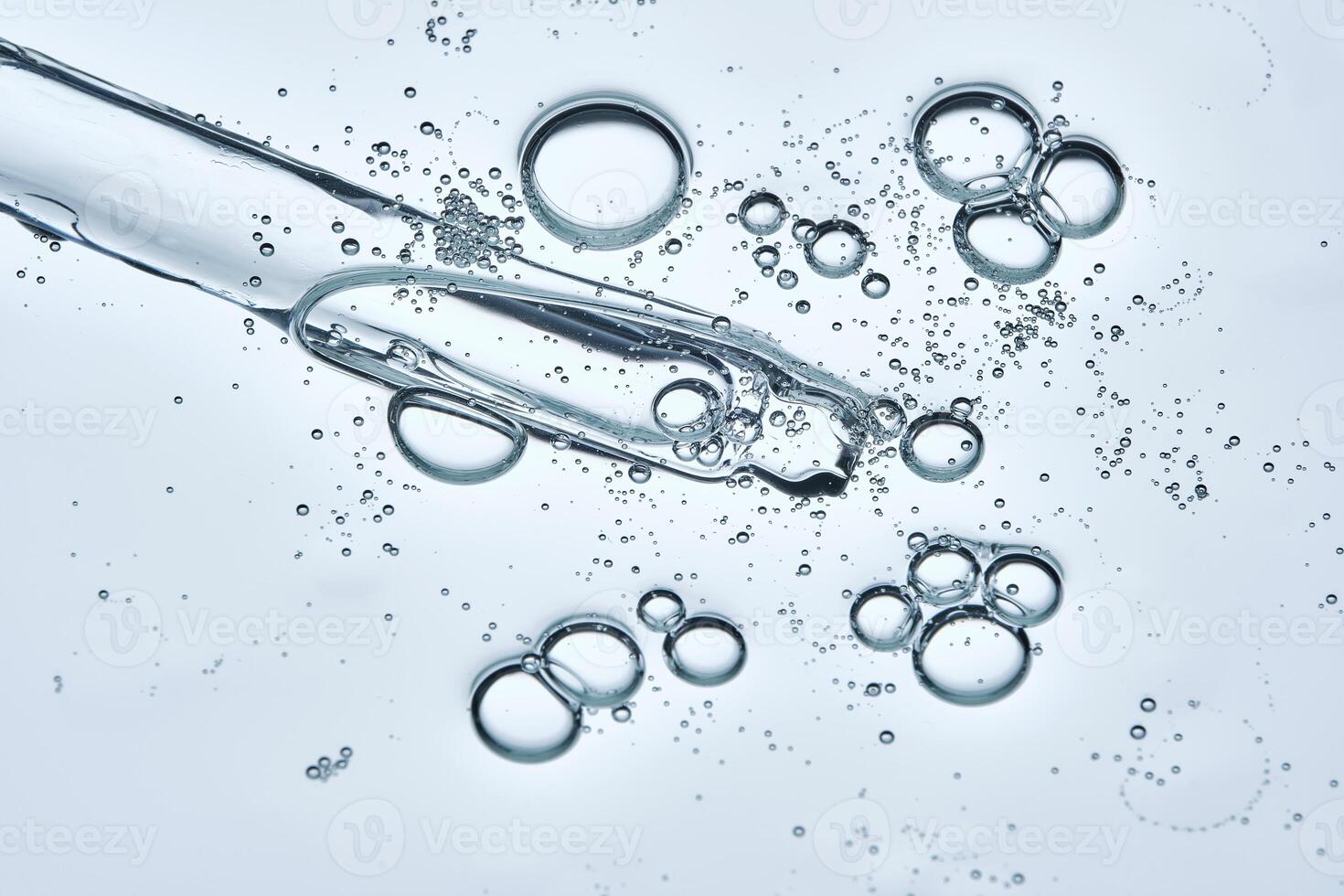 The texture of a serum or cosmetic gel with a dropper. photo