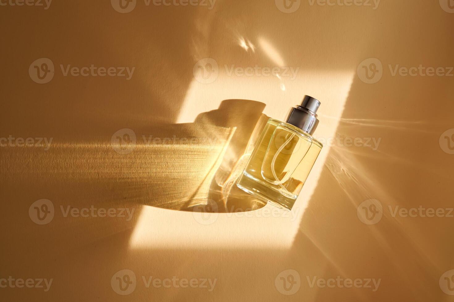 Beautiful photo of perfume on a beige background with highlights.
