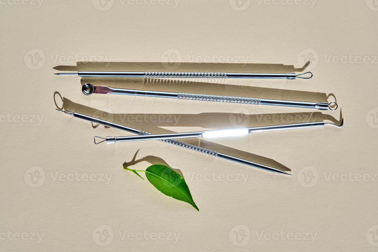 Tools for mechanical facial cleansing at home or at a cosmetologist on a beige background. photo