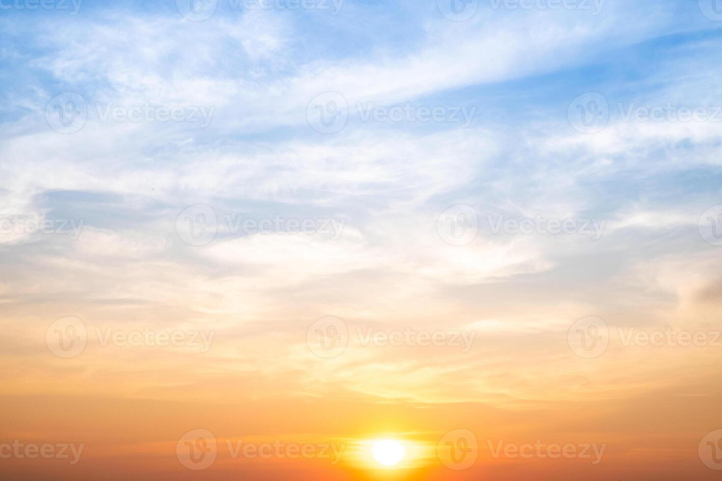 Beautiful , luxury soft gradient orange gold clouds and sunlight on the blue sky perfect for the background, take in evening,Twilight, Large size, high definition lands photo