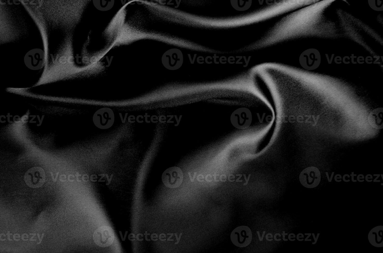Top view of dark fabric showing smooth texture. Suitable for design and wallpaper background photo