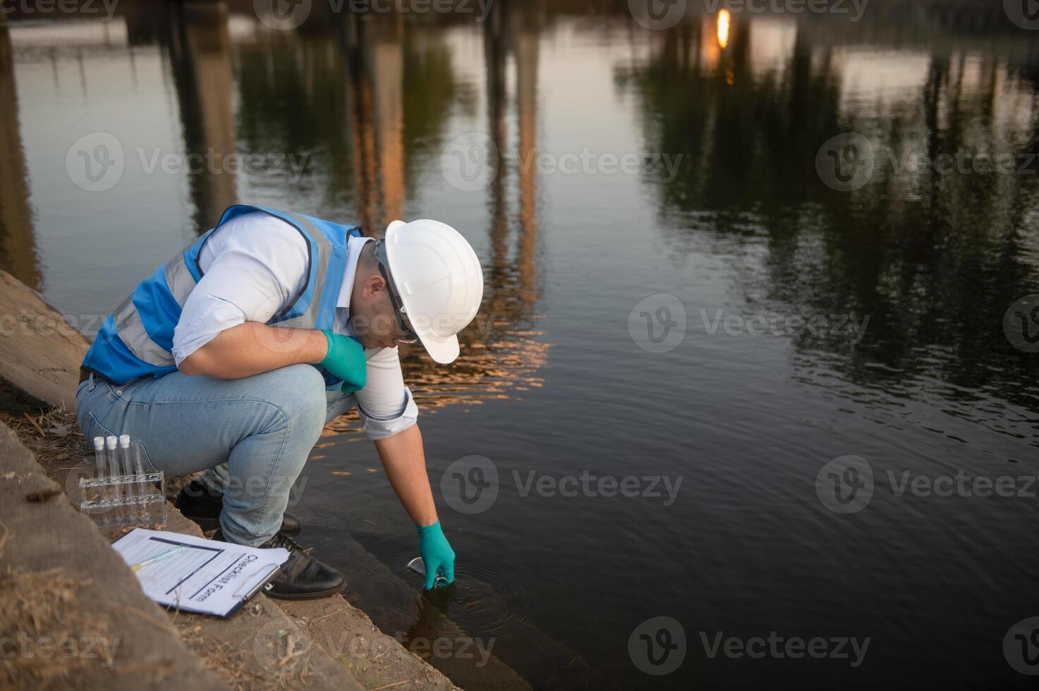 A water resource worker is collecting water sample photo