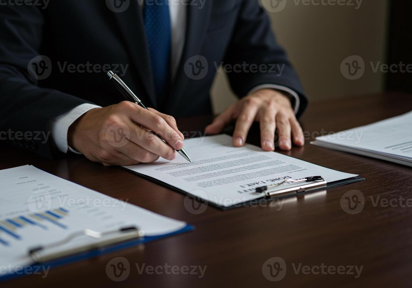 Business executives reviewing and signing a contract photo