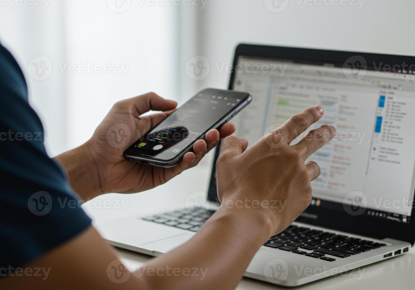 Businessman Using Smartphone and Laptop for Business Work photo