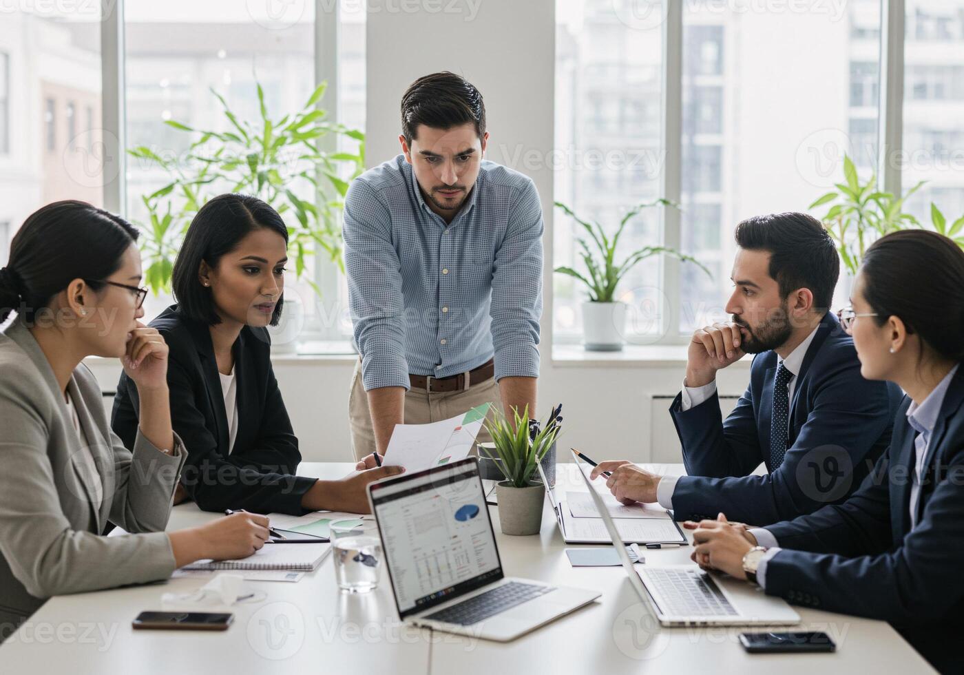 Business team collaborating during a presentation in a modern office setting. photo