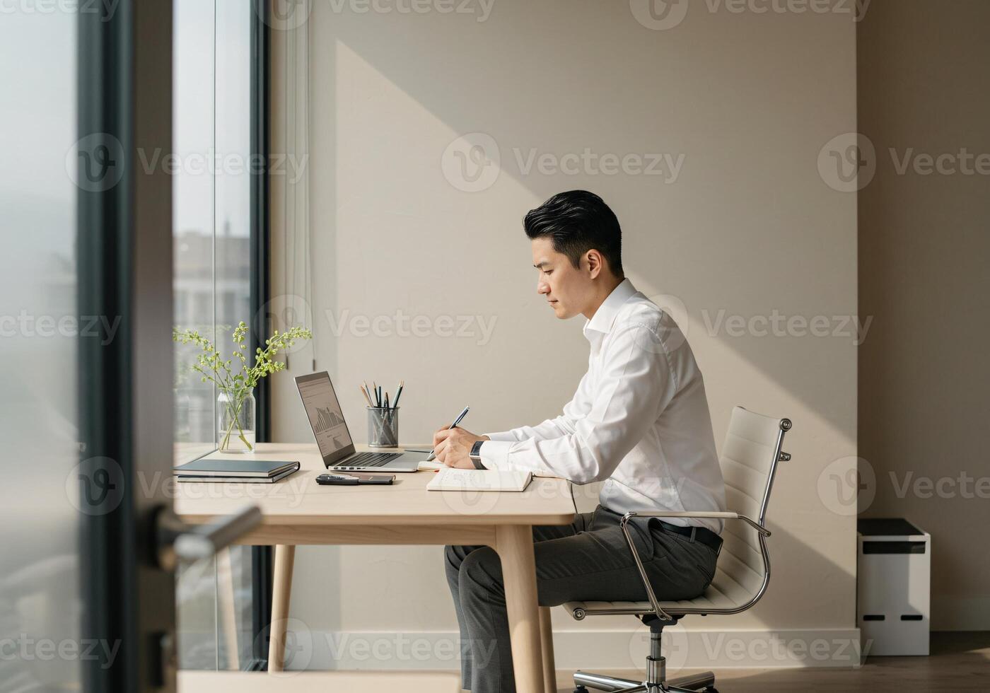 Minimalist Office with Man Working Alone photo