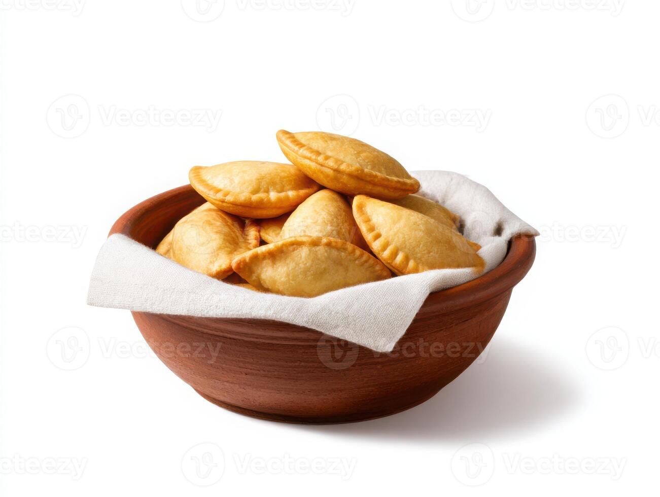 A bowl filled with empanadas on a white background photo