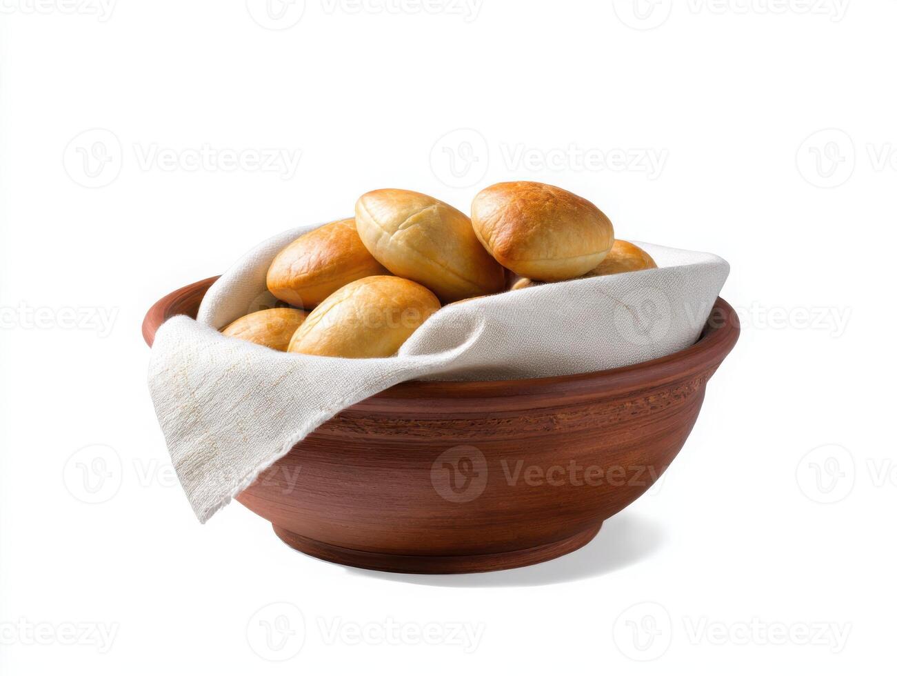 A bowl filled with bread rolls on a white background photo