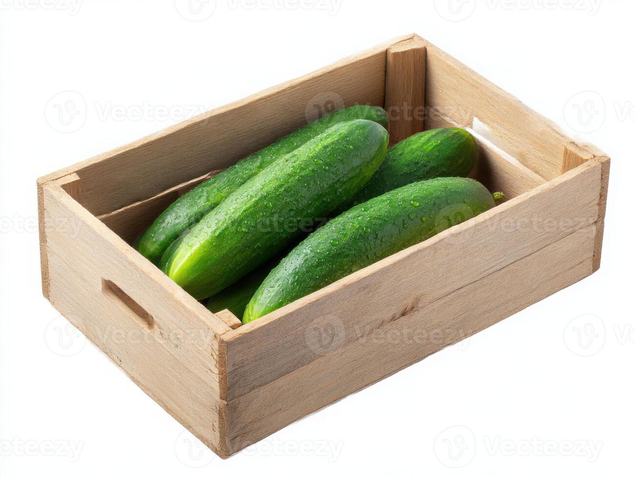 Cucumbers in wooden box on white background photo