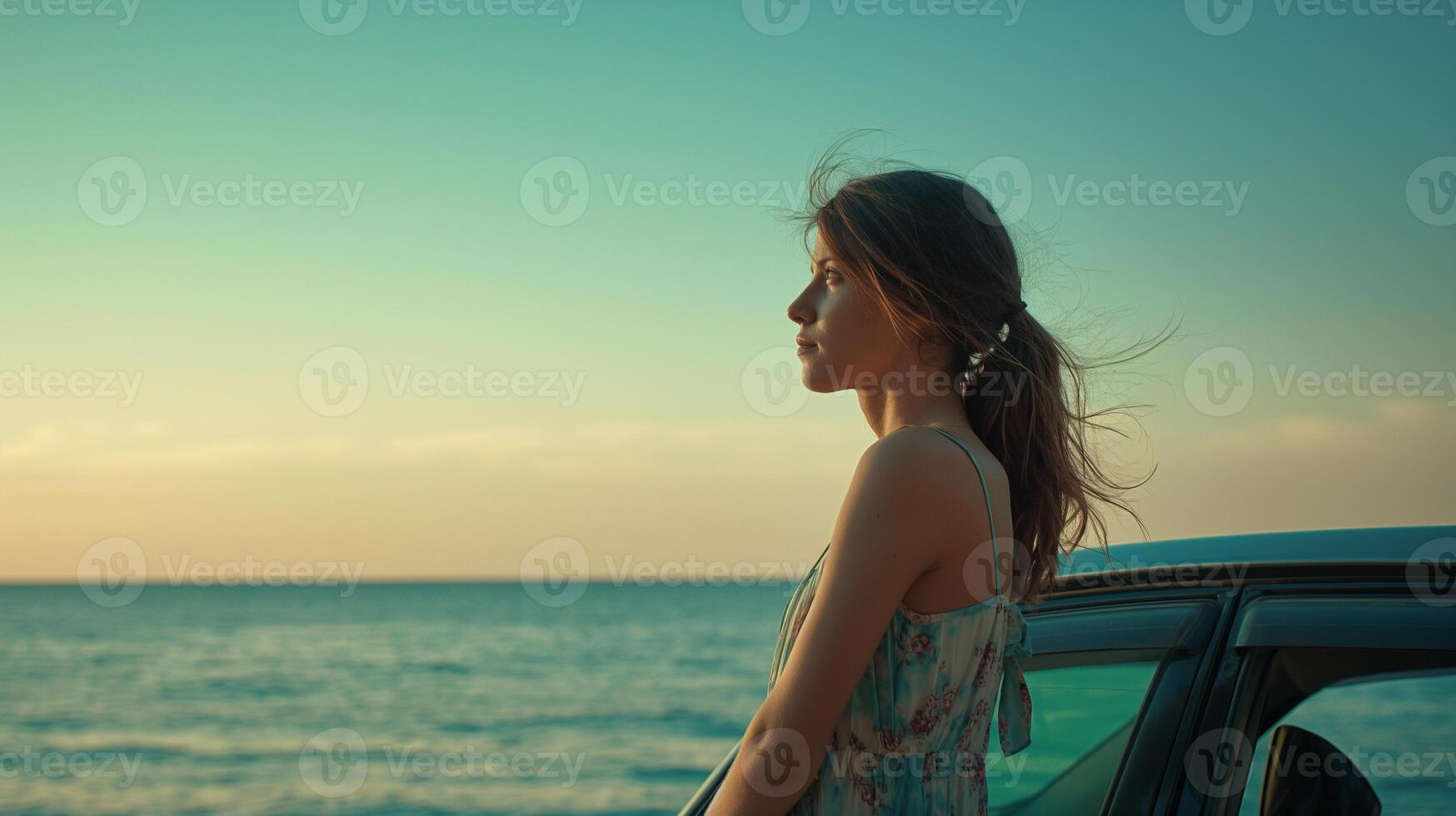 A traveler woman leaning against a vehicle with ocean on the background photo