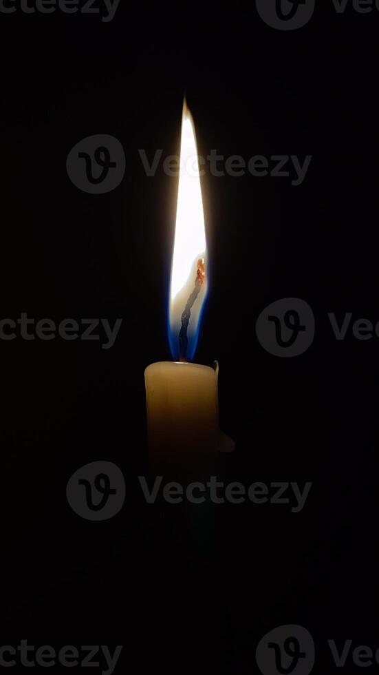 Glowing Candle in the Dark photo