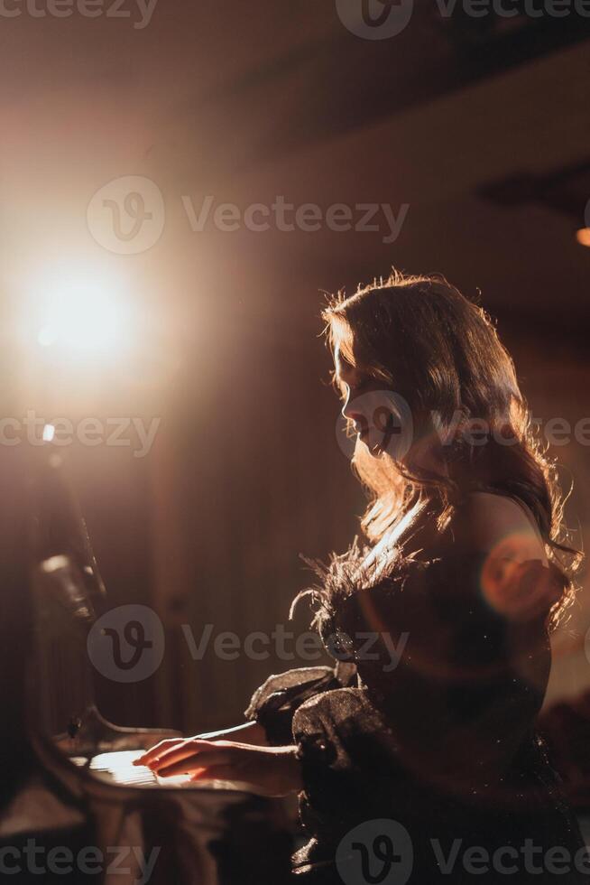 Romantic Silhouette by Piano with Dramatic Lighting photo