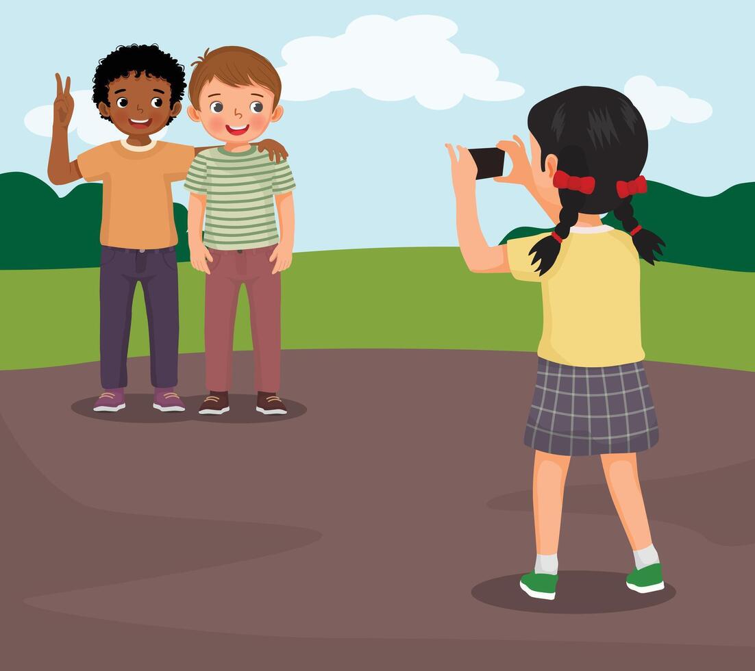 little girl taking a photograph of boy friends using smartphone in the park vector