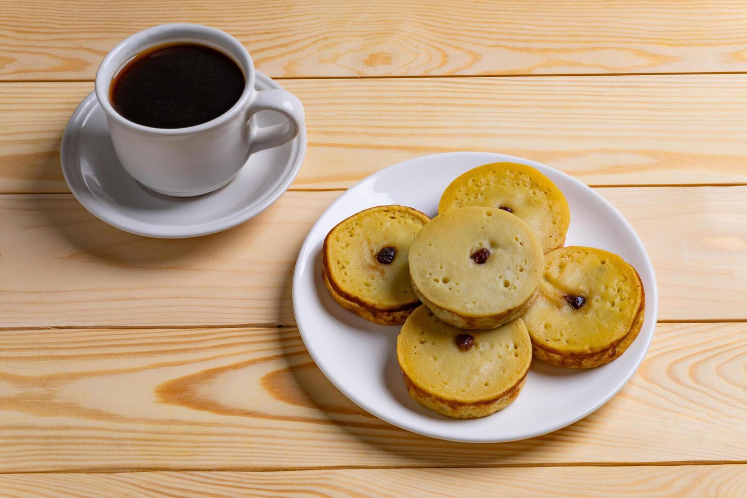 Kue Lumpur as a Timeless Treat in a Modern Light with Coffee photo