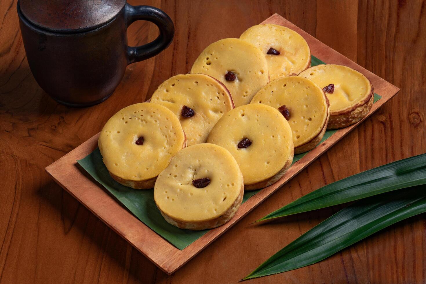 Kue lumpur brings the rich flavor of Indonesian tradition and heritage at brown plate photo