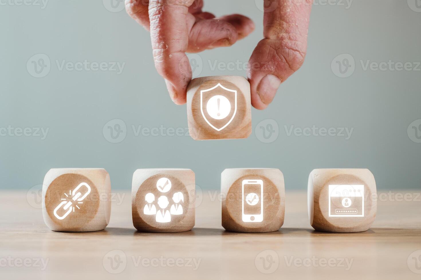 Visual representation of strong customer authentication using security icons on wooden blocks, emphasizing digital safety. photo