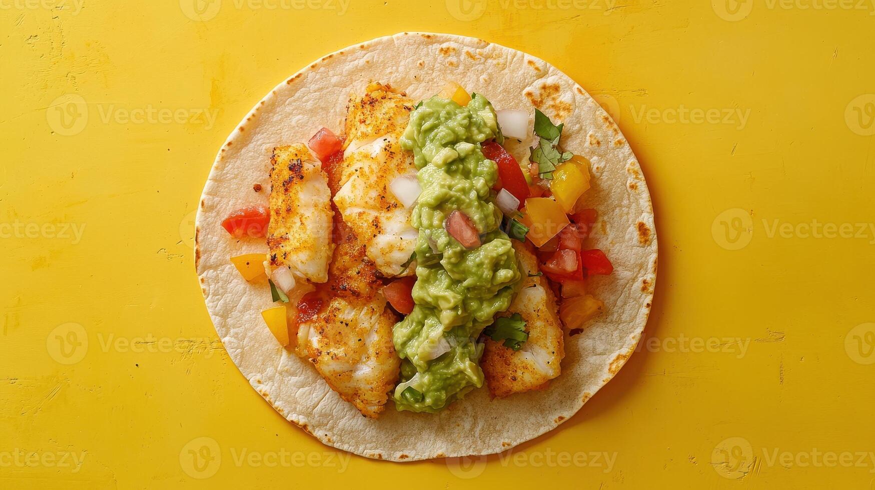 Delicious Crispy Fish Taco Delightfully Served with Fresh Guacamole on a Vibrant Plate for Culinary Photography and Food Blogs photo