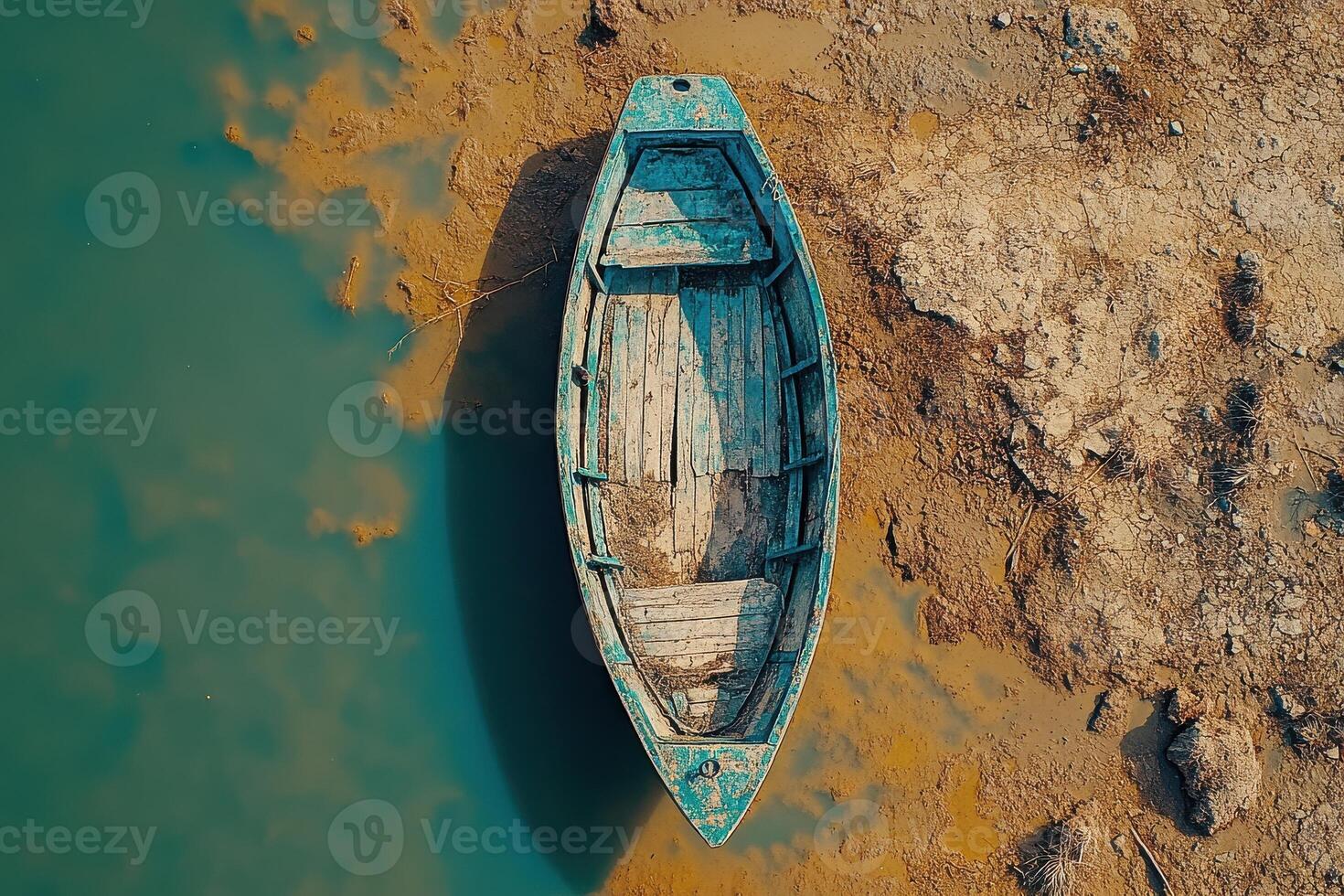 Aerial View of a Stranded Fishing Boat on a Remote Shoreline Illustrating the Dangers of Maritime Activities photo