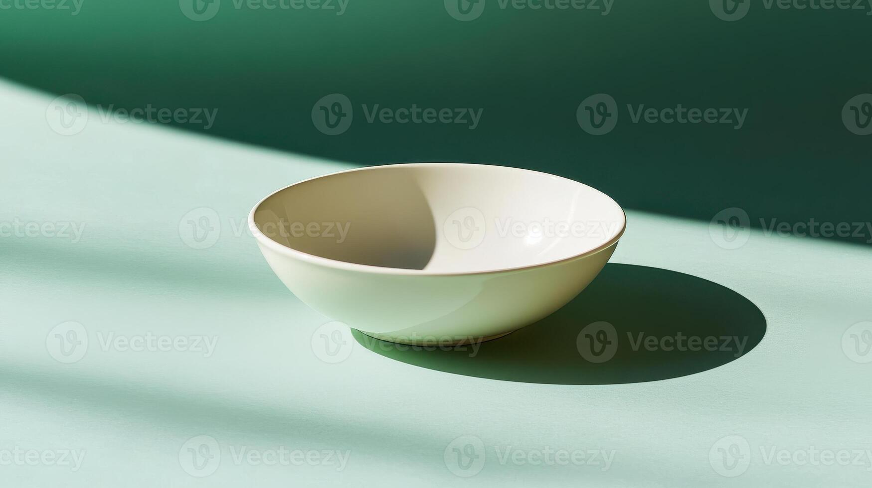 Elegant Simple White Ceramic Dish Perfectly Set on a Plain Green Background for Food Displays and Culinary Presentations photo