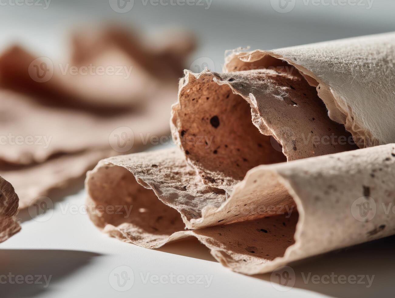 Rolled cocoa husk recycled paper sheets photo