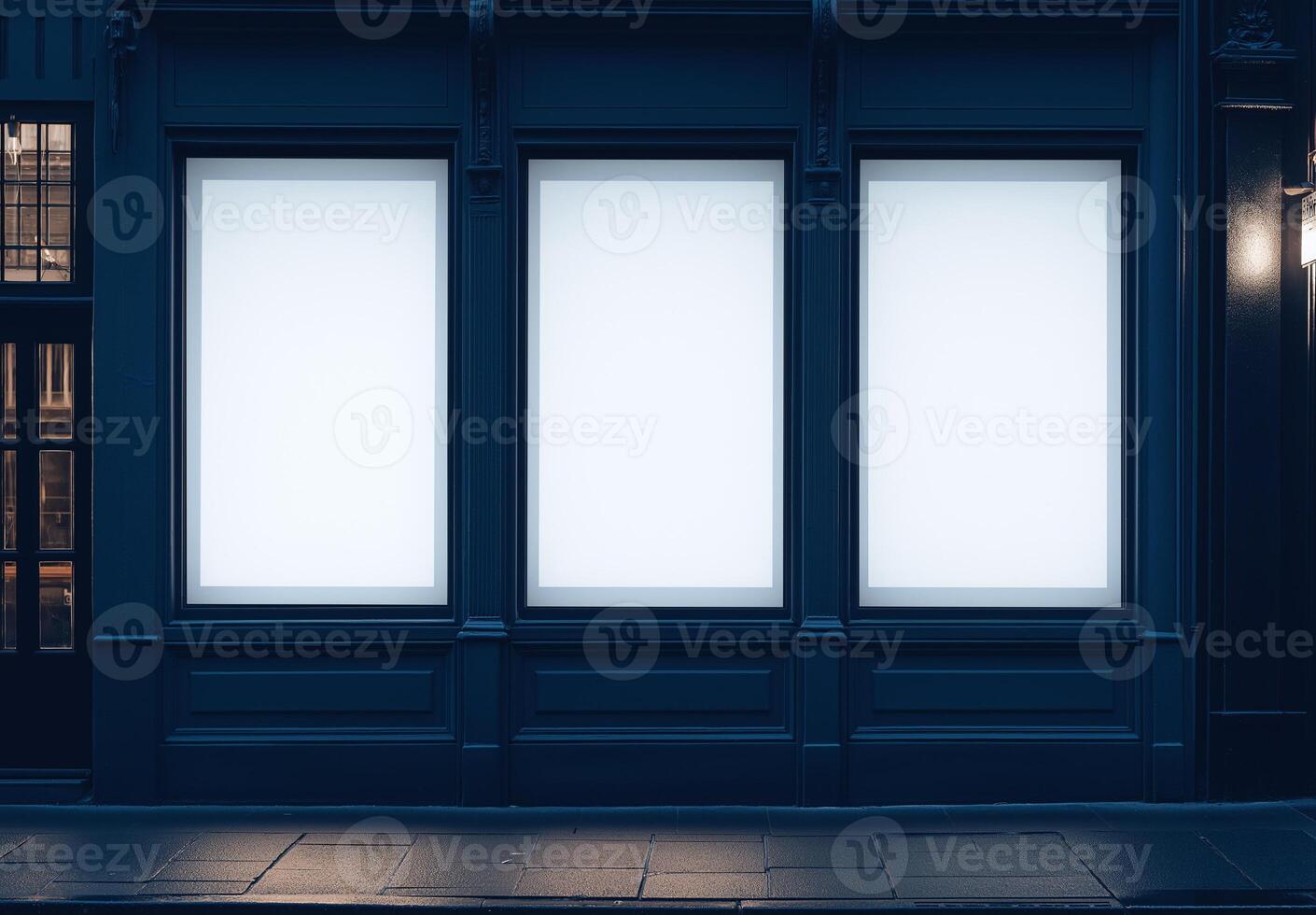 Three large windows on a building with a blue background photo
