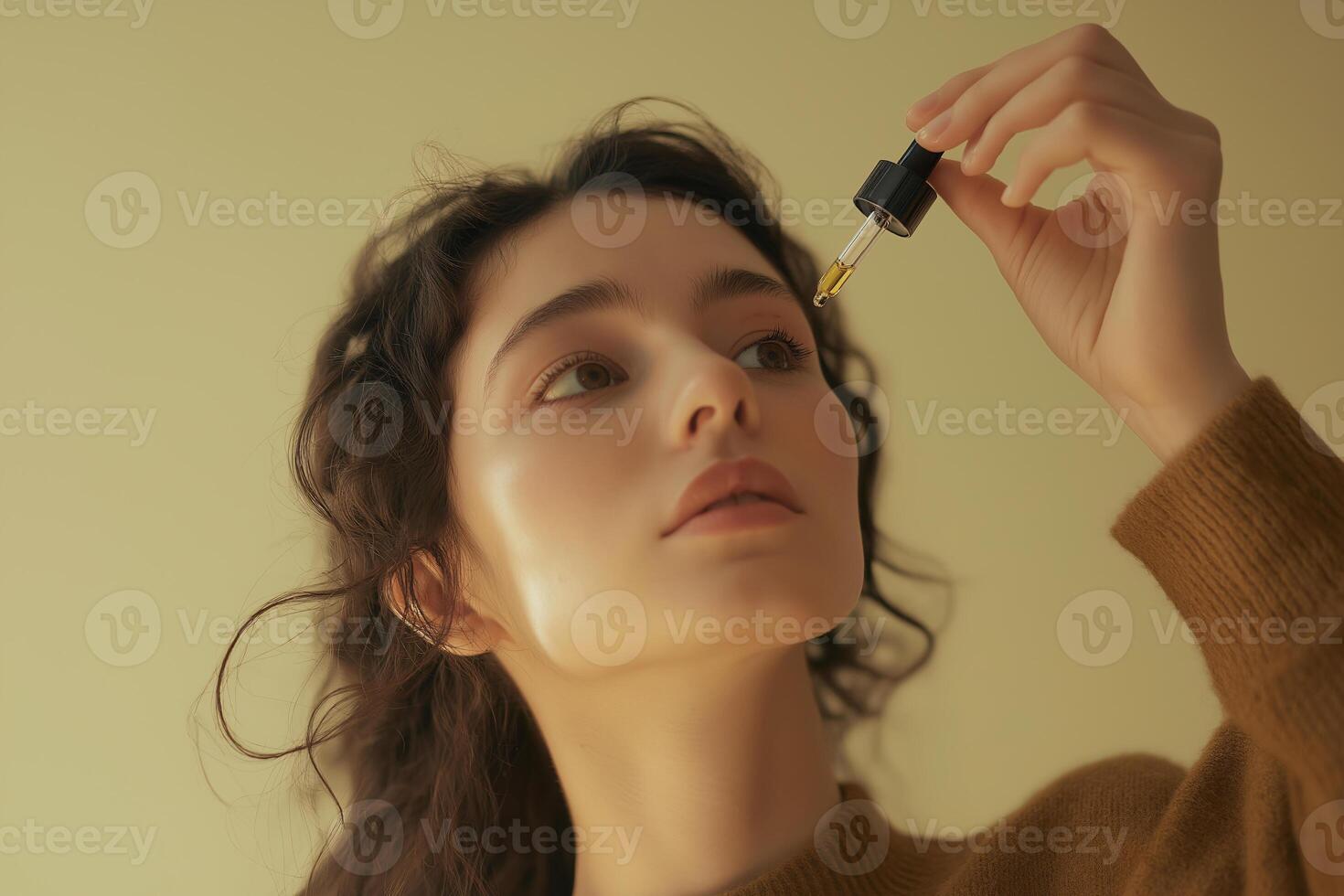 A woman is holding a bottle of oil photo